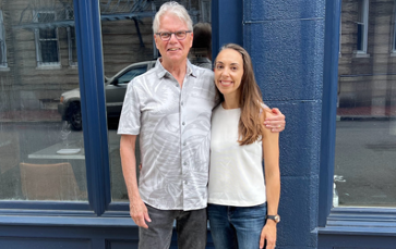 Dennis Carlone and Adrienne Klein standing in front of a building in Cambridge