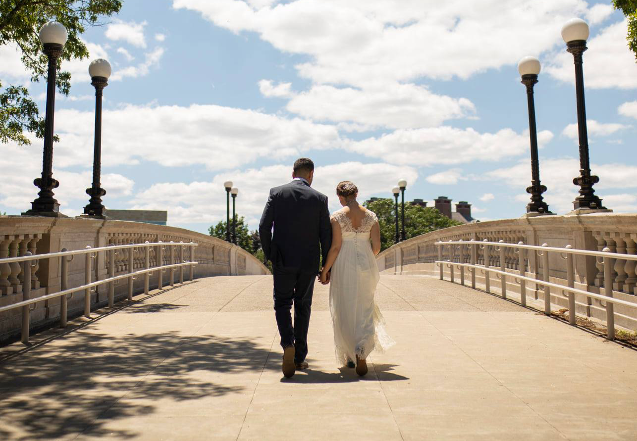 An image of Adrienne and her husband on their wedding day in Cambridge